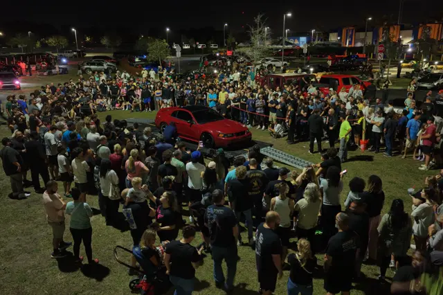 Visitors gathered around a featured car at a previous Shift Culture event